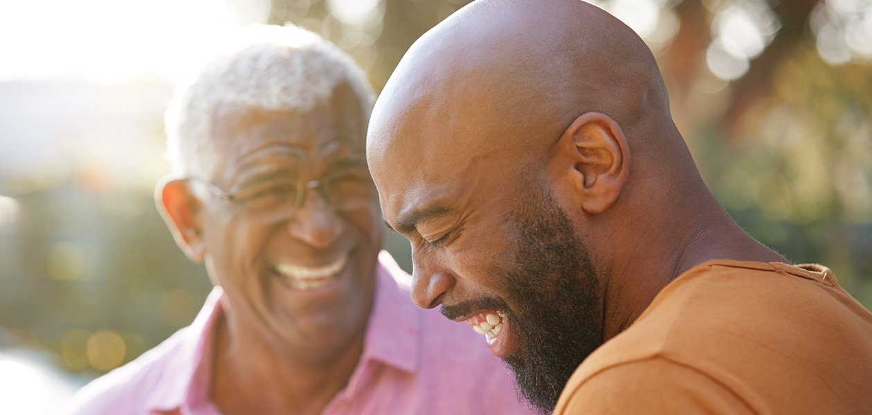 senior father talking and laughing with adult son 2026 01 05 06 27 41 utc