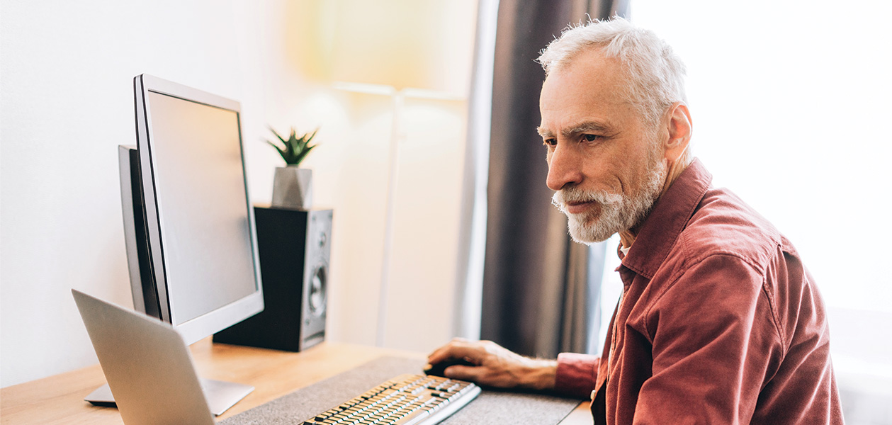 senior man working on laptop at desk 2026 03 27 02 07 44 utc