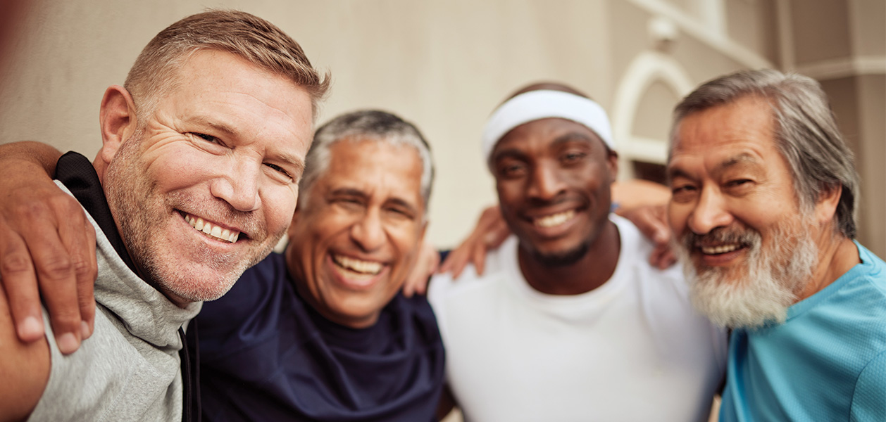 smiling men friends embrace outdoors 2026 03 25 03 05 54 utc