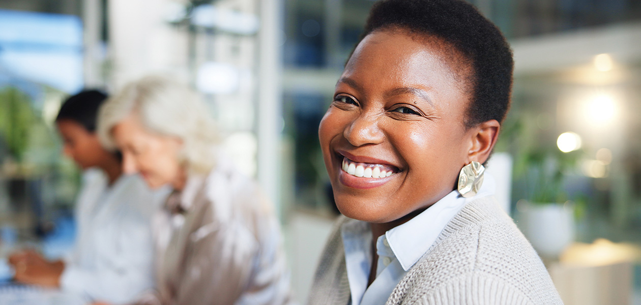 smiling woman in business setting 2026 01 09 10 02 05 utc