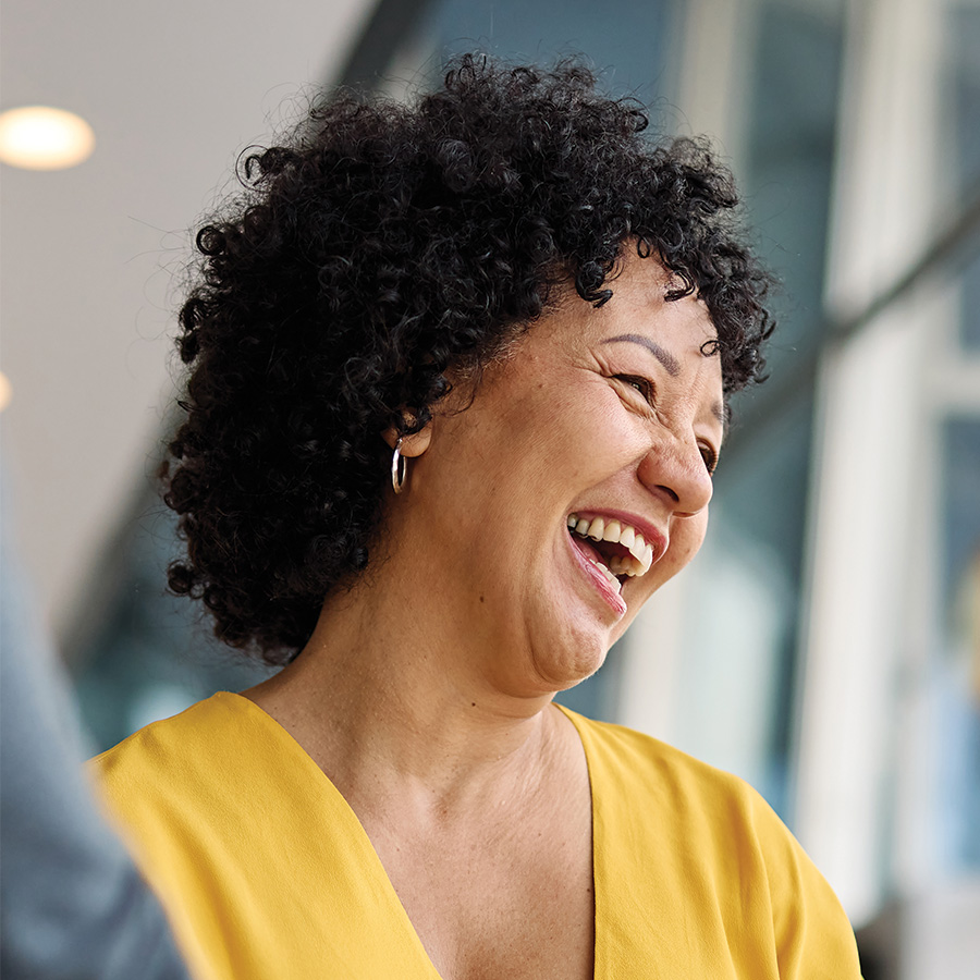 woman laughing happily in office setting 2026 01 11 11 08 56 utc