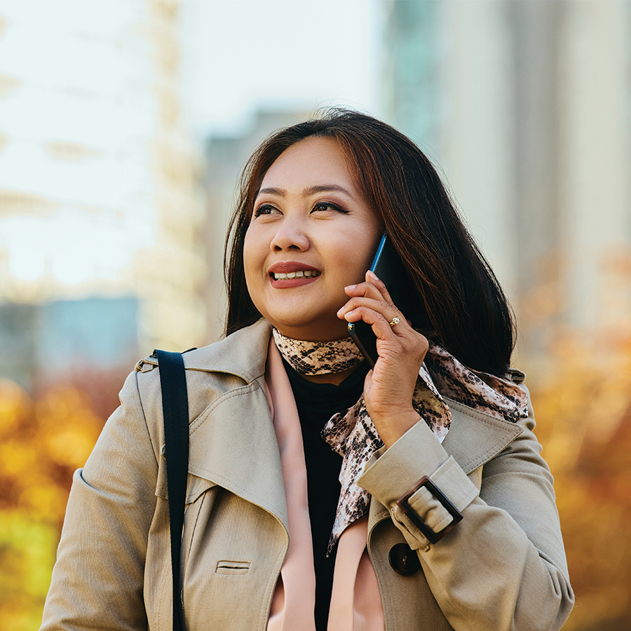 happy asian woman communicating on cell phone outd 2026 03 16 03 28 02 utc