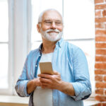 senior man with phone at home 2022 01 19 00 03 39 utc