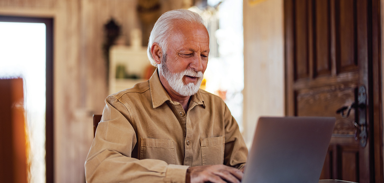 senior man using laptop at home 2026 03 25 22 42 58 utc